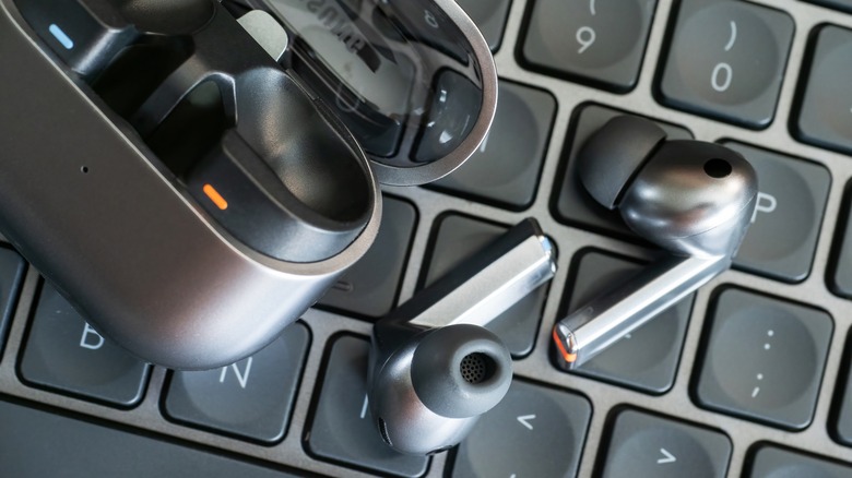 Samsung Galaxy Buds3 Pro sitting on a keyboard