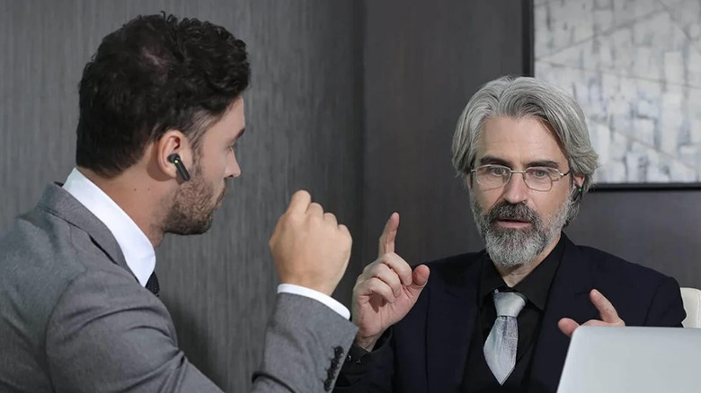 business men using the Timekettle WT2 Edge earbuds for a meeting