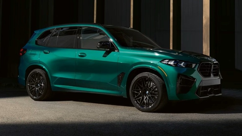 Isle of Man Green metallic 2025 BMW X5 M Competition parked on a paved surface