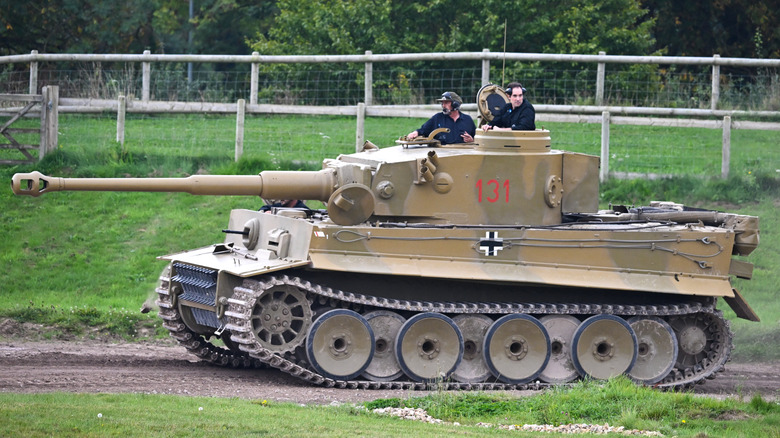 A Tiger tank being driven on a rough track.