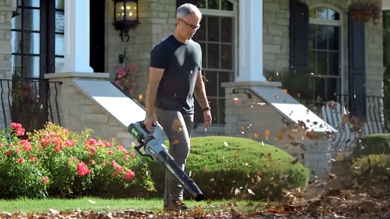 Person using EGO handheld leaf blwoer