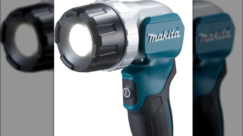 A Makita LED flashlight lit up.