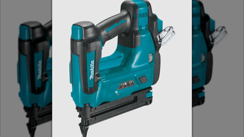 A blue Makita brad nailer facing down.