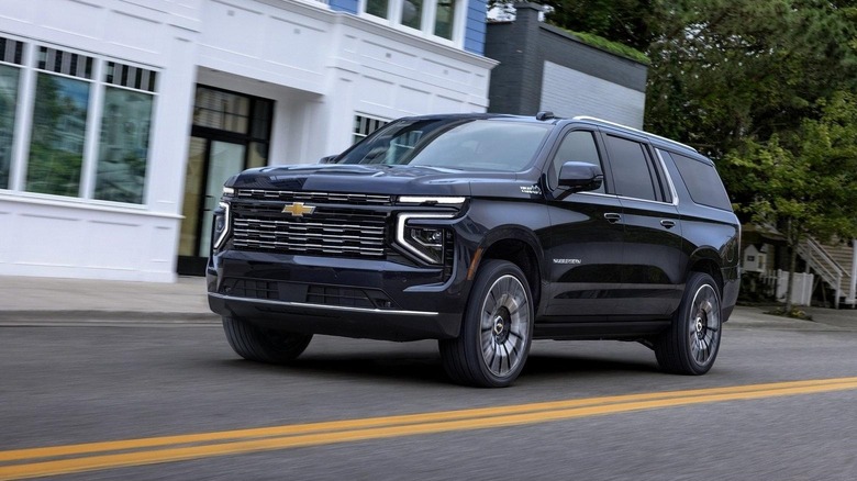 Front-left quarter action shot of a 2025 Chevy Suburban