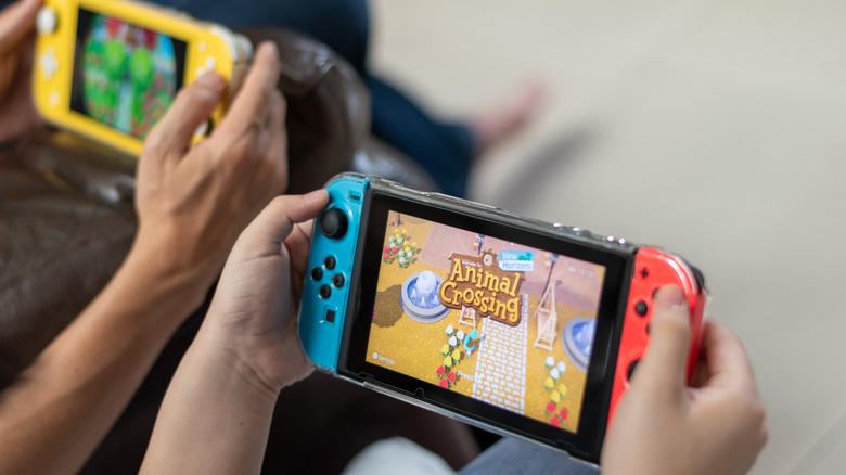 Switch consoles playing "Animal Crossing"