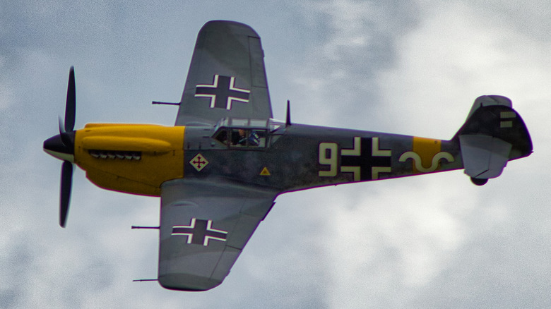 A Messerschmitt Bf109 flying in an overcast sky