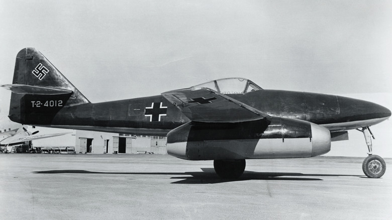 Black & White photo of a Messerschmitt Me 262 Schwalbe parked on a runway