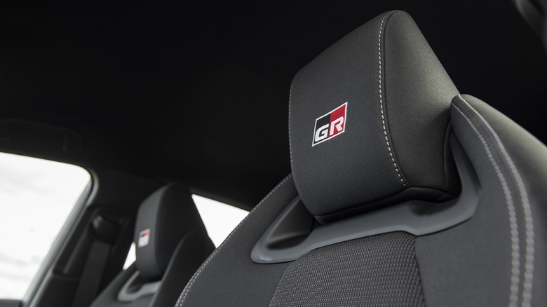 GR logo embossed on car seats