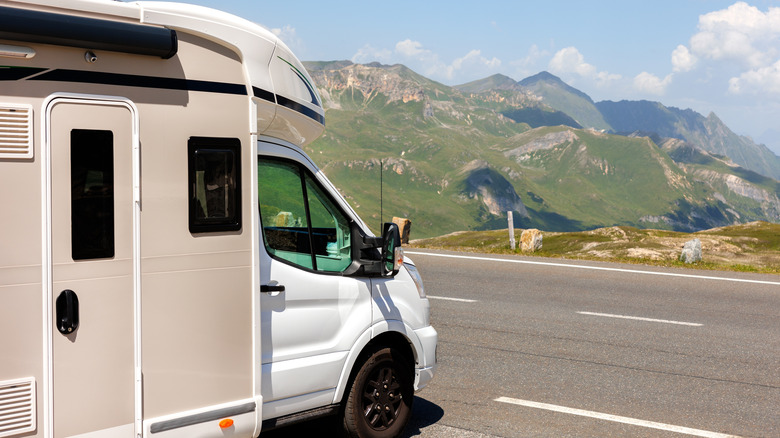 An RV pointed towards a road.