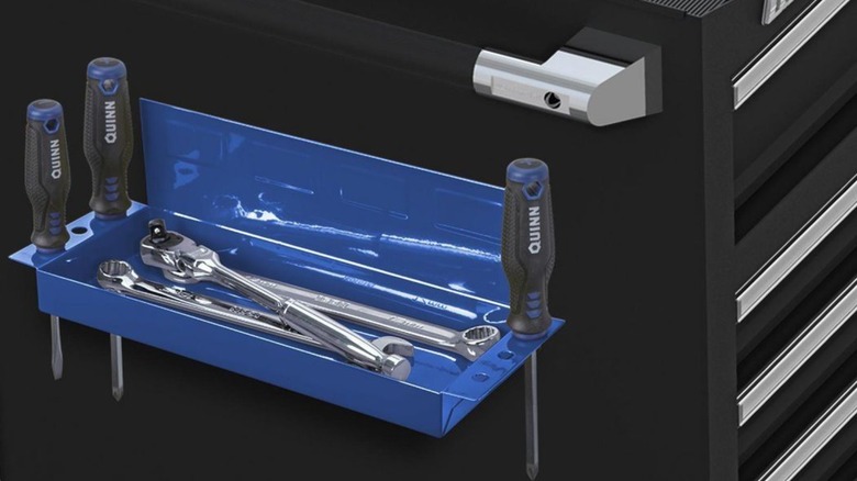 Screwdrivers and wrenches inside a metal tray