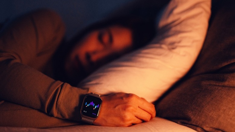 Person sleeping while wearing a smartwatch