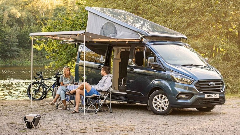 couple sitting Ford Nugget