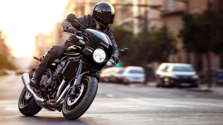 A Kawasaki Z900RS Cafe navigating city streets.