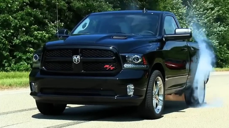 2015 RAM 1500 R/T Hemi In Black Smoking Up The Rear Tires Before Launch