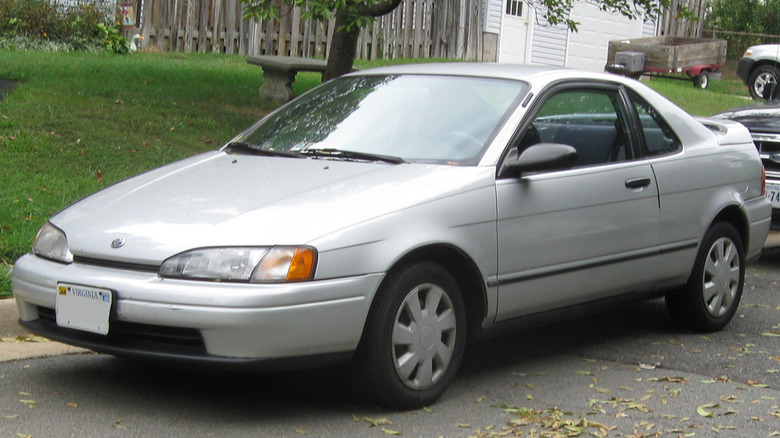 Silver Toyota Paseo parked on suburban street