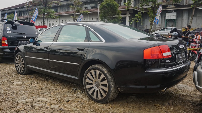 Black Audi D3 A8 parked rear quarter view