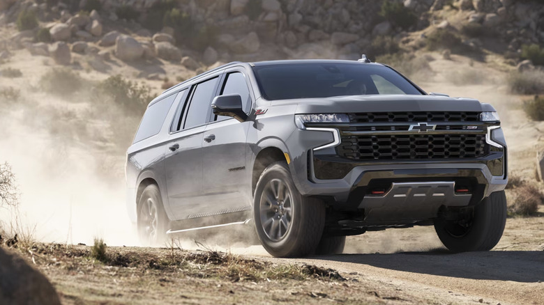 Grey Chevy Suburban on desert terrain