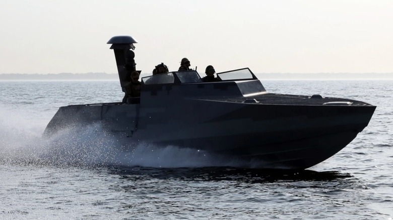 A Combatant Craft Assault boat drives on the water.