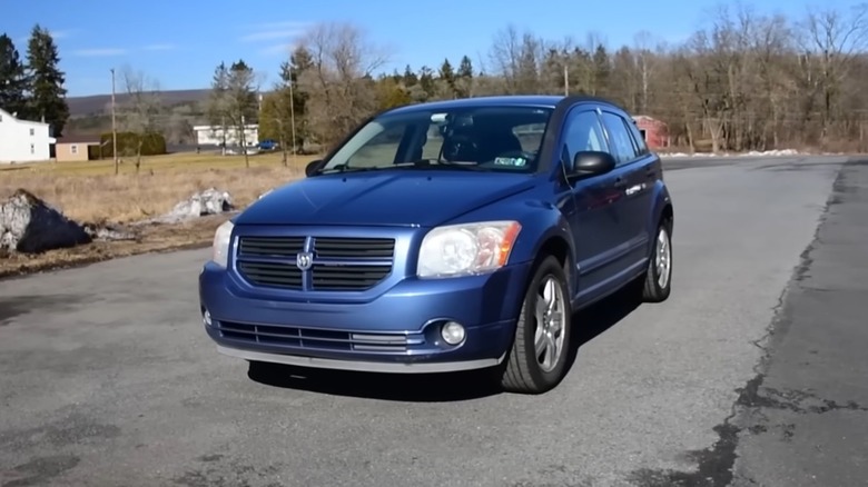 A 2007 Dodge Caliber travels down a road