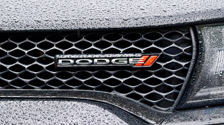 A Dodge logo on the grille of a Charger