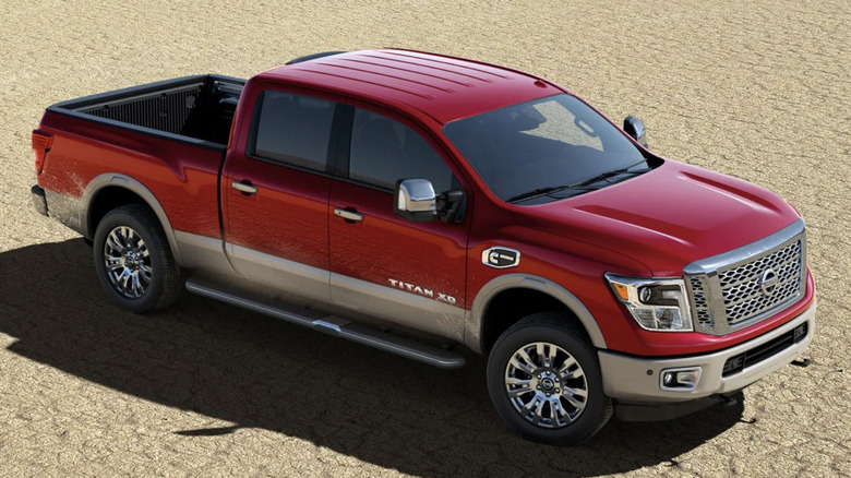 Front 3/4 shot of a Nissan Titan XD Diesel parked off-road