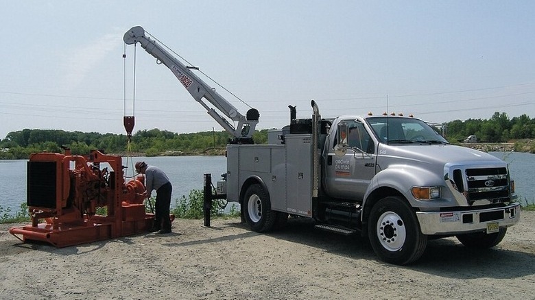 2004–2015 F-750 Super Duty with a crane attached parked near a body of water