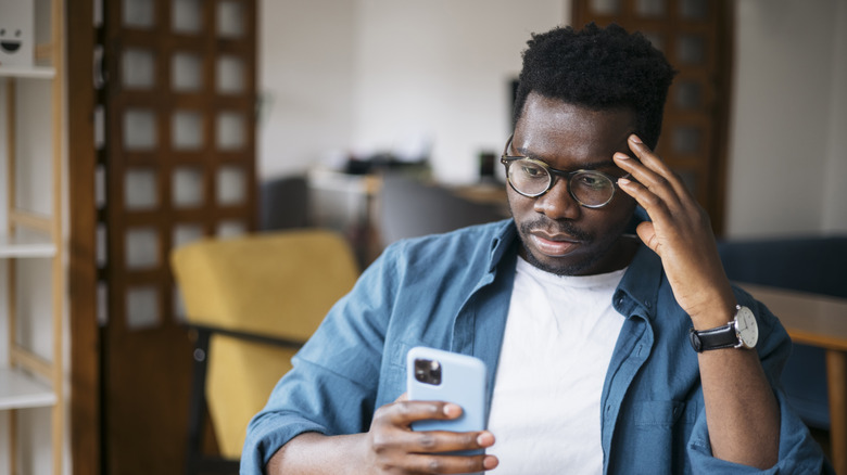 A man using an iPhone