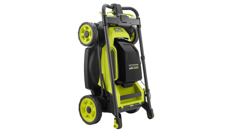 Ryobi lawn mower with collapsible handles stored upright