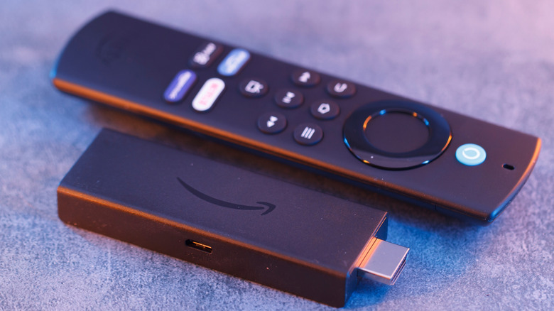 Amazon Fire TV stick next to a Fire TV remote