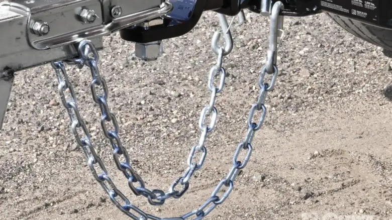 Chains attaching a trailer to a vehcile