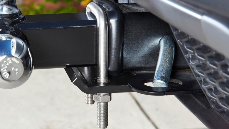 Anti-rattle hitch clamp on receiver