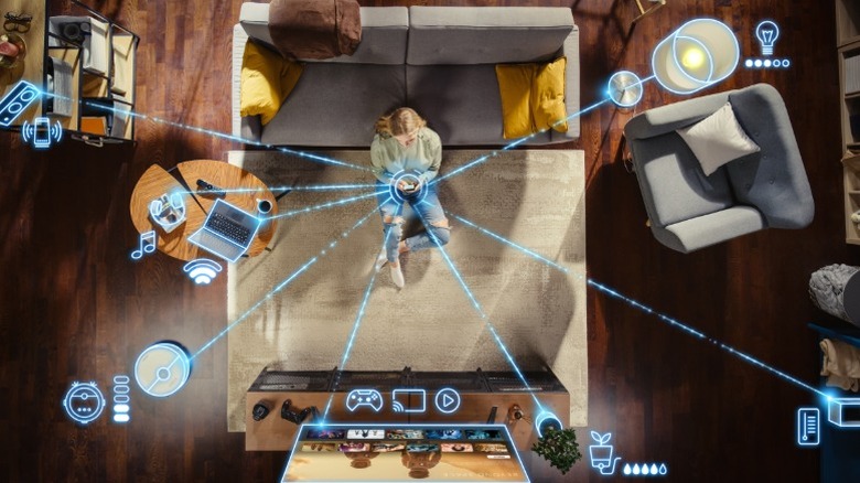 Person controlling smart home devices using a tablet