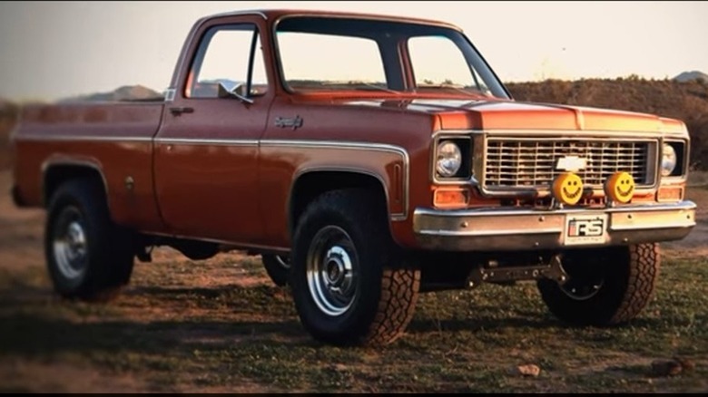 A highly modified Burnt Orange 1973 C10 Chevy truck.