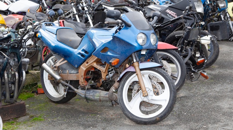 Junkyard motorcycles with some useful parts remaining.