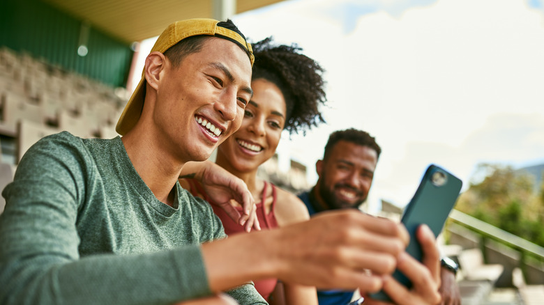 People looking at a smartphone