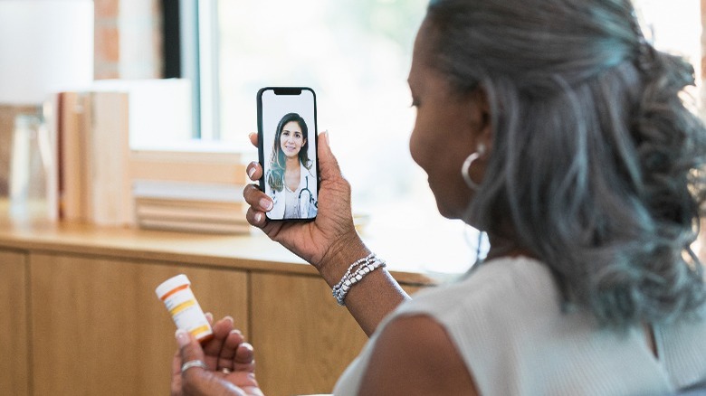 A woman on a FaceTime call with a doctor