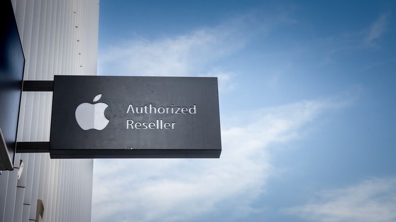 An Apple Authorized Reseller sign outside a store in Serbia