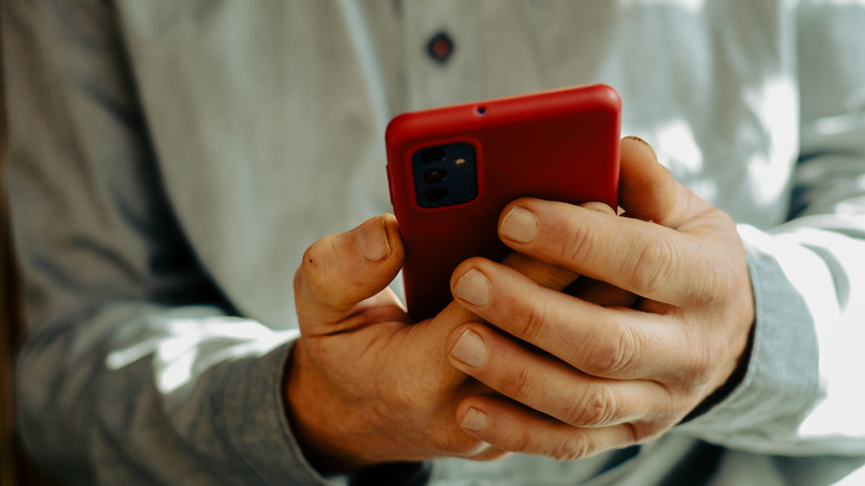 person holding their phone