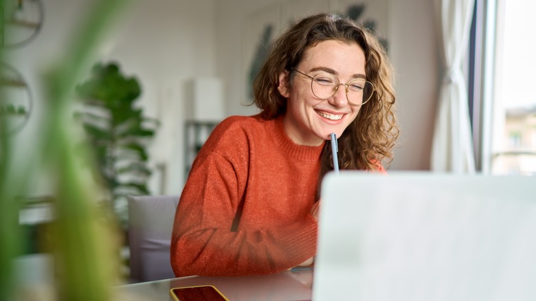 Woman attending a meeting and laughing