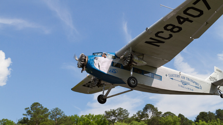 Ford Trimotor flying through clear sky