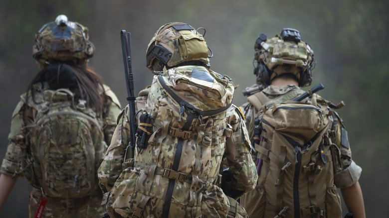 Three military soldiers in full fatigues and gear