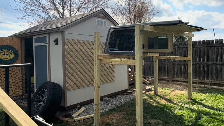 Jeep hard top stored on wood shelves