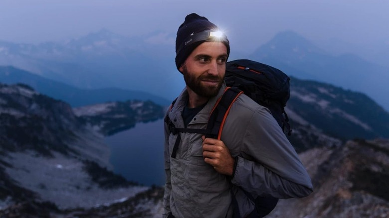 Man hiking with headlamp on