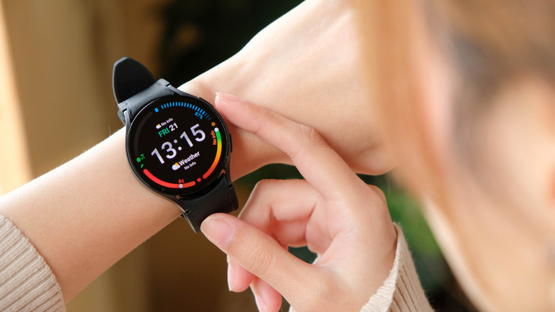 Woman using Samsung Galaxy Watch 6