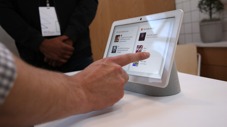 Person using Google Nest Hub