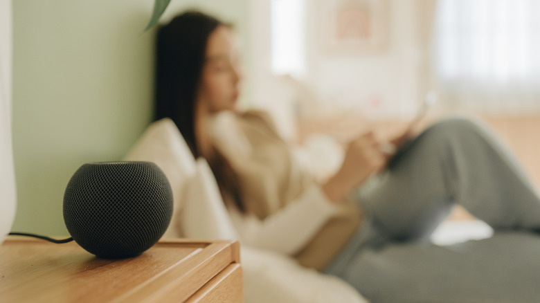 Smart Speaker with lady laying on bed