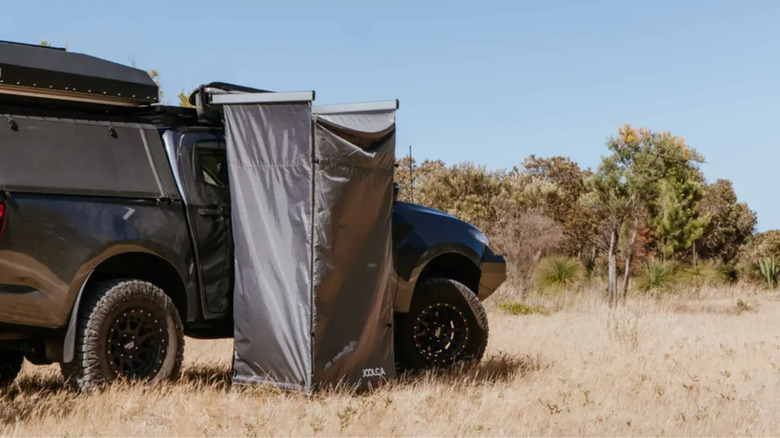 Shower tent attached to a truck