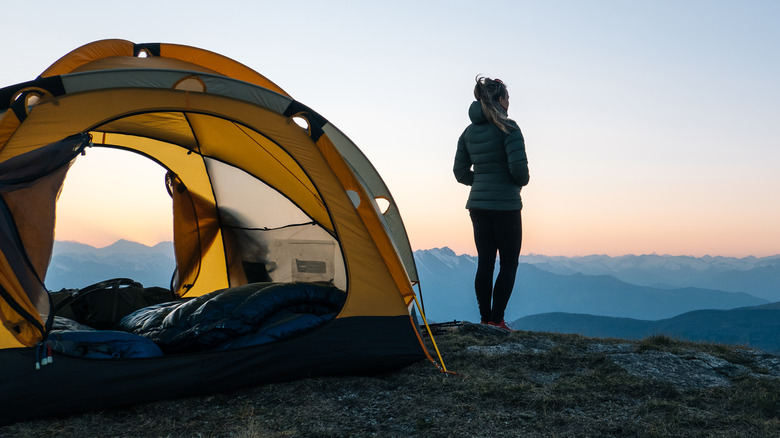 Woman at camp site sunrise