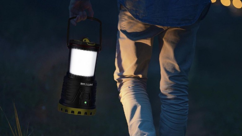 Person walking with lantern