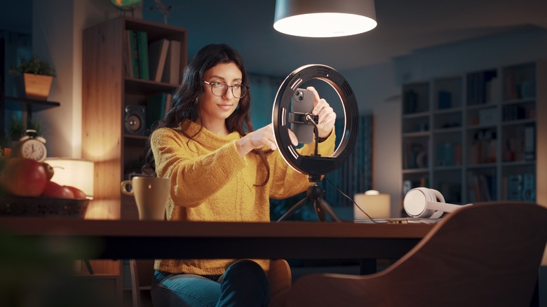 Woman recording herself on a phone